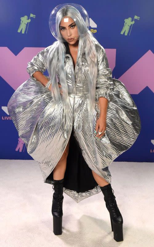 <p>A metallic coat dressed paired with a space bubble mask? Why not, we say. </p>