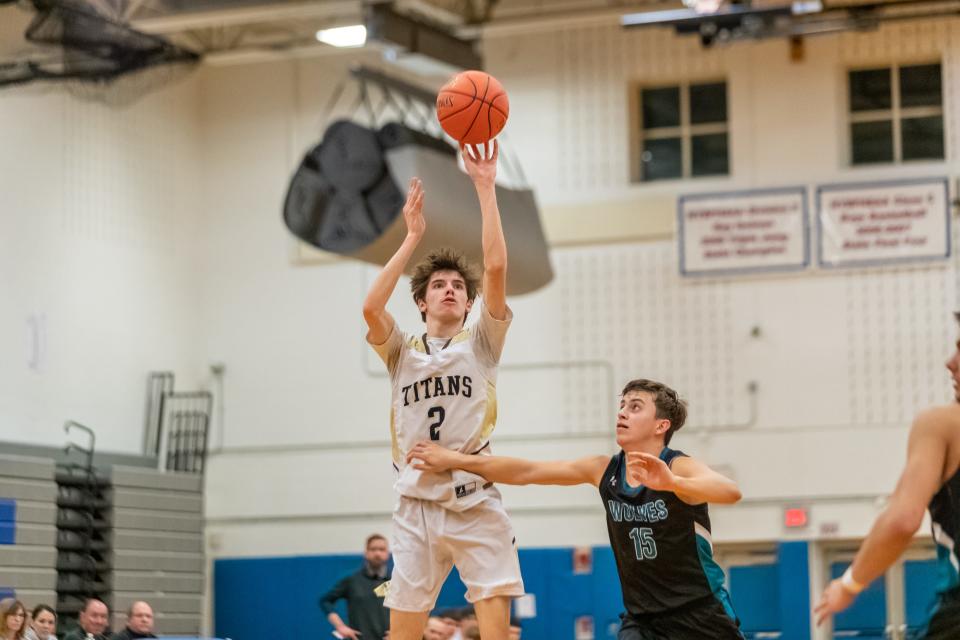 Steuben County 2023-24 Boys Basketball MVP Macoy Putnam puts up a shot over Arkport-Canaseraga's Ibra Ford as Avoca-Prattsburgh punched its ticket to the finals of the Steuben County Tournament with a 60-43 win Saturday. Macoy finished the night with 8 points.