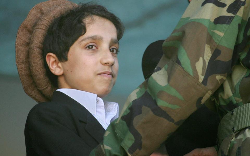 Ahmad as a 14-year-old at the remembrance ceremony for his father in Kabul's sport stadium - PA PHOTO/EPA/OLIVIER MATTHYS