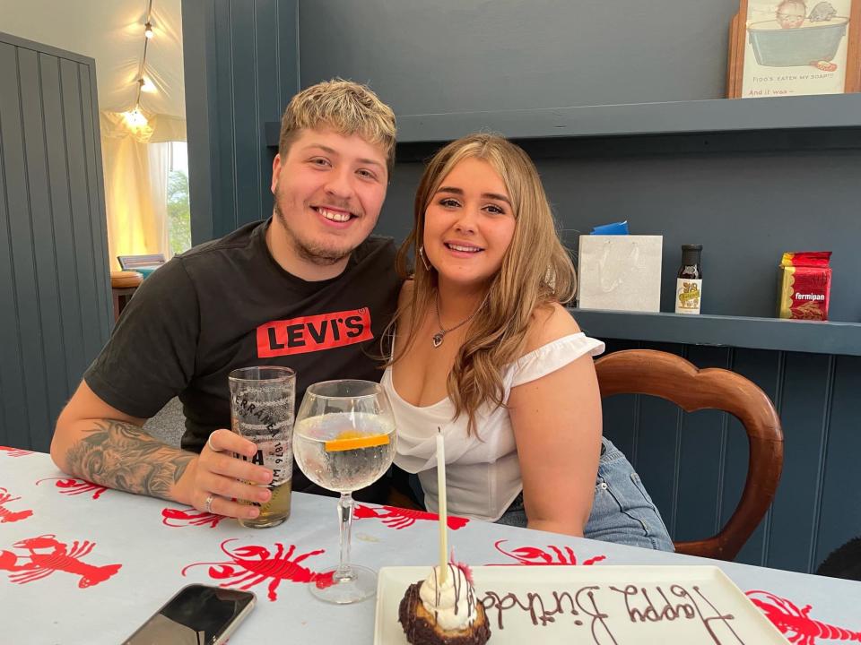 Craig McKinnon and Jess Prinsloo celebrate a birthday at a restaurant. 