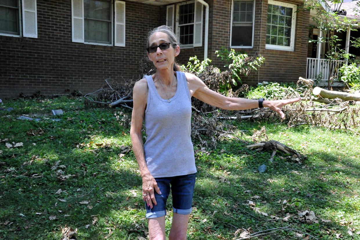 Worksite homeowner Alicia Pfalzgraf had trees on her house and driveway trapping her in her house.