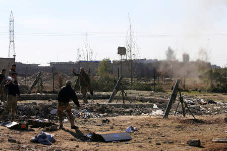 Iraqi rapid response forces fire mortar shells towards Islamic State positions in Wahda district of eastern Mosul, Iraq, January 6, 2017. REUTERS/Alaa Al-Marjani