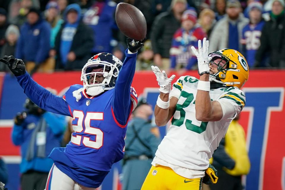 New York Giants cornerback Deonte Banks (25) breaks up a pass to Green Bay Packers wide receiver Samori Toure (83) during an NFL football game on Monday, Dec. 11, 2023, in East Rutherford, N.J. (AP Photo/Bryan Woolston)