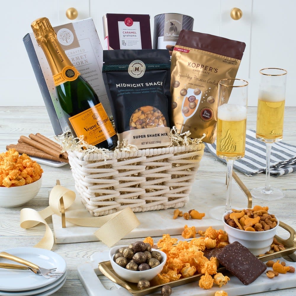 <p><a href="https://go.redirectingat.com?id=74968X1596630&url=https%3A%2F%2Fwww.gourmetgiftbaskets.com%2FMidnight-Snack-Veuve-Champagne-Basket.asp%3Fgad_source%3D1%26cid%3D17699989602%26gclid%3DCjwKCAjwh4-wBhB3EiwAeJsppC34rA2mu7-IgR88x6p9giYOKrzwwFvk9-cDrQjzdeCICOPOQ0qj0BoCVaYQAvD_BwE&sref=https%3A%2F%2Fwww.esquire.com%2Flifestyle%2Fg60323283%2Fbest-luxury-gift-baskets-for-women%2F" rel="nofollow noopener" target="_blank" data-ylk="slk:Shop Now;elm:context_link;itc:0;sec:content-canvas" class="link rapid-noclick-resp">Shop Now</a></p><p>Midnight Snack Veuve Champagne Basket</p><p>gourmetgiftbaskets.com</p><p>$159.99</p>