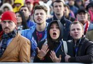 Russian fans react as they watch a broadcast of the ice hockey quarter-final match between Russia and Finland in the Olympic Park during the 2014 Winter Olympic Games in Sochi February 19, 2014. REUTERS/Shamil Zhumatov