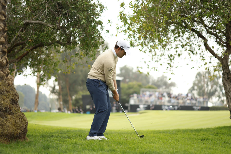 Patrick Cantlay hits off the fairway rough on the 10th hole during the third round of the Genesis Invitational golf tournament at Riviera Country Club, Saturday, Feb. 17, 2024, in the Pacific Palisades area of Los Angeles. (AP Photo/Ryan Kang)