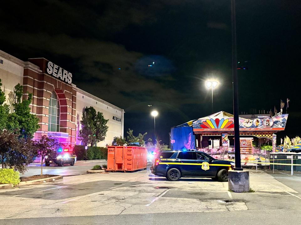 More than an hour after two people were shot at a carnival at the Concord Mall Saturday night, police remained on scene.