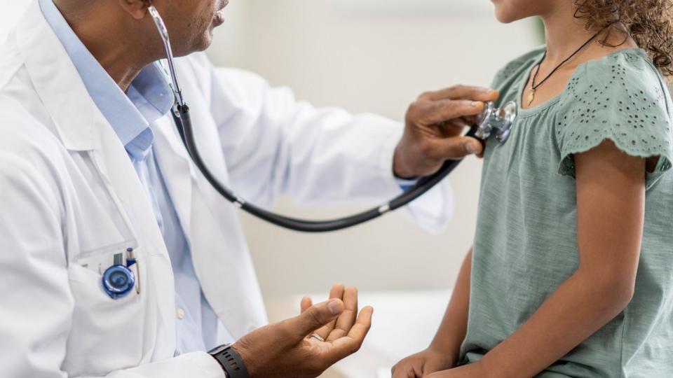 PHOTO: A stock photo showing a doctor using a stethoscope to examine a young child's chest. (STOCK PHOTO/Getty Images)