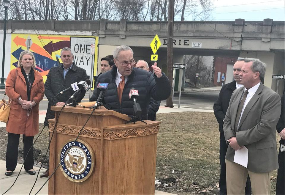With the Norfolk Southern railroad viaduct as a backdrop, U.S. Sen. Charles Schumer, D-N.Y., is joined by local officials in front of the Elmira Fire Department headquarters Monday, March 6, 2023 to discuss new federal legislation to address rail safety.
