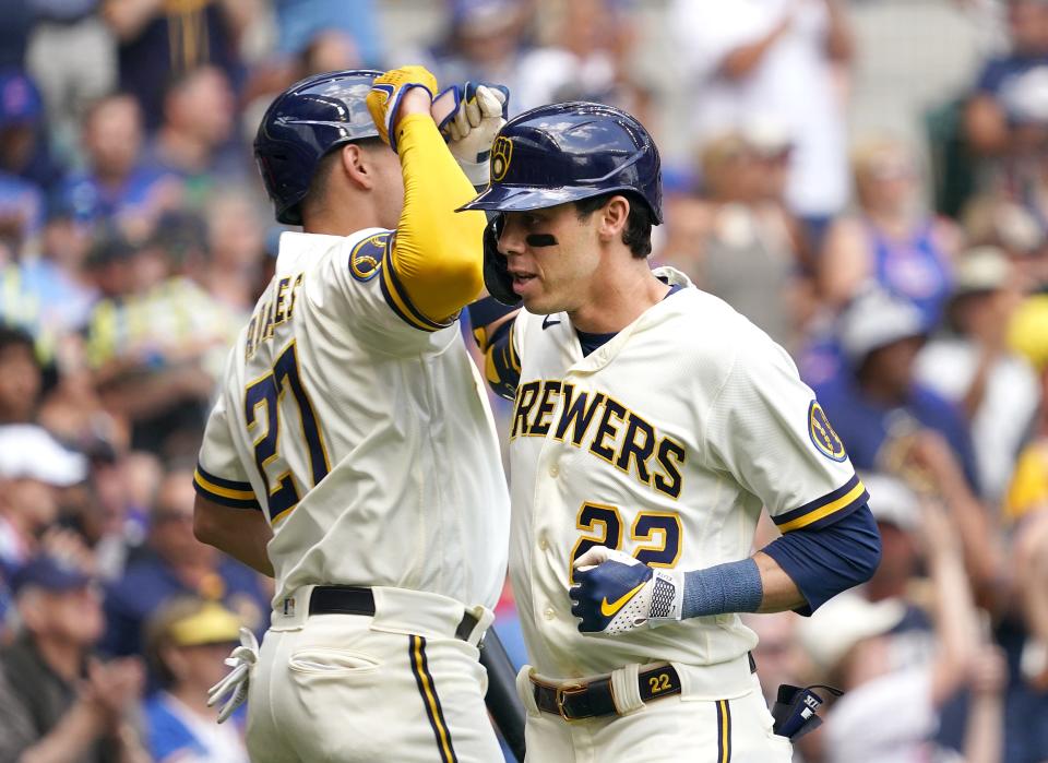 Brewers leftfielder Christian Yelich is greeted with a forearm smash from Willy Adames after hitting a three-run home run against the Cubs in the fifth inning Thursday at American Family Field.