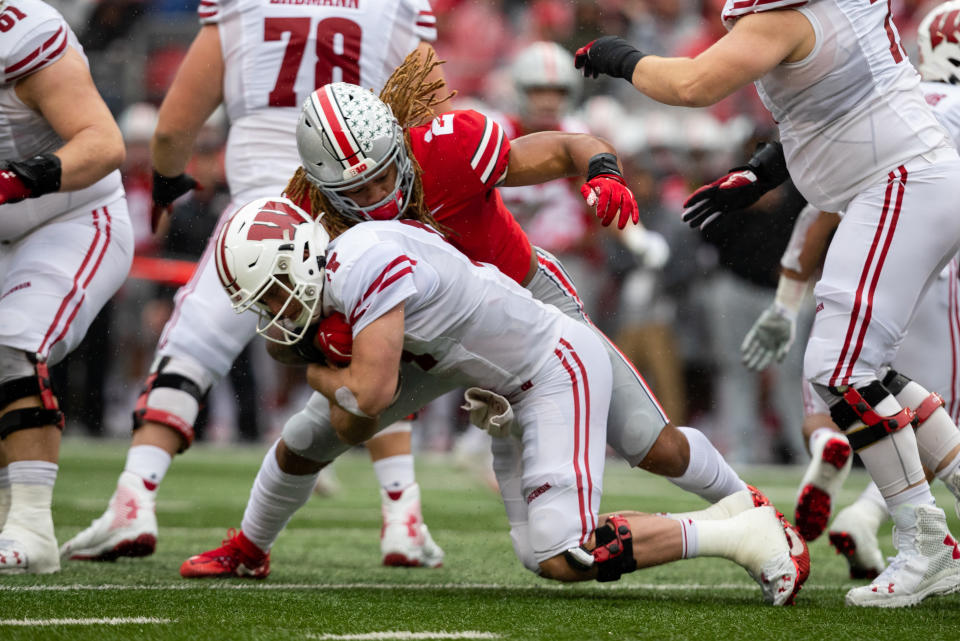 Ohio State's Chase Young takes down Wisconsin QB Jack Coan for one of his four sacks on Saturday. (Getty)