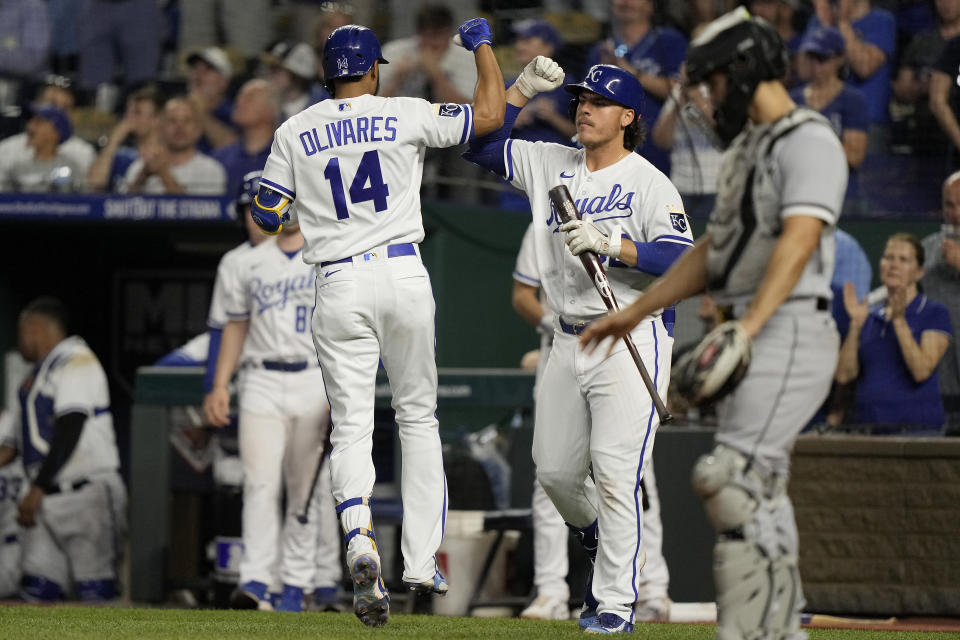 Kansas City Royals' Edward Olivares (14) celebrates with Nick Pratto after hitting a solo home run during the seventh inning of a baseball game against the Chicago White Sox Wednesday, May 10, 2023, in Kansas City, Mo. (AP Photo/Charlie Riedel)