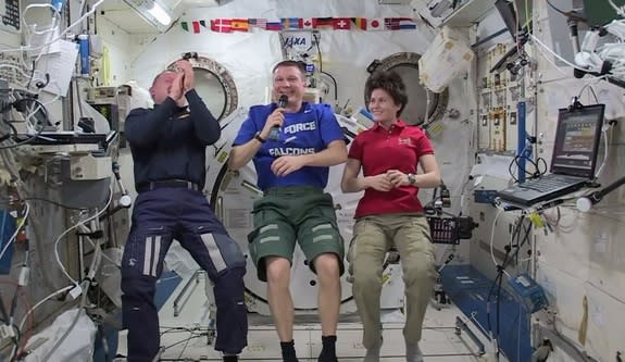 Barry "Butch" Wilmore, Terry Virts and Samantha Cristoforetti give an in-flight interview on Jan. 28, 2015.