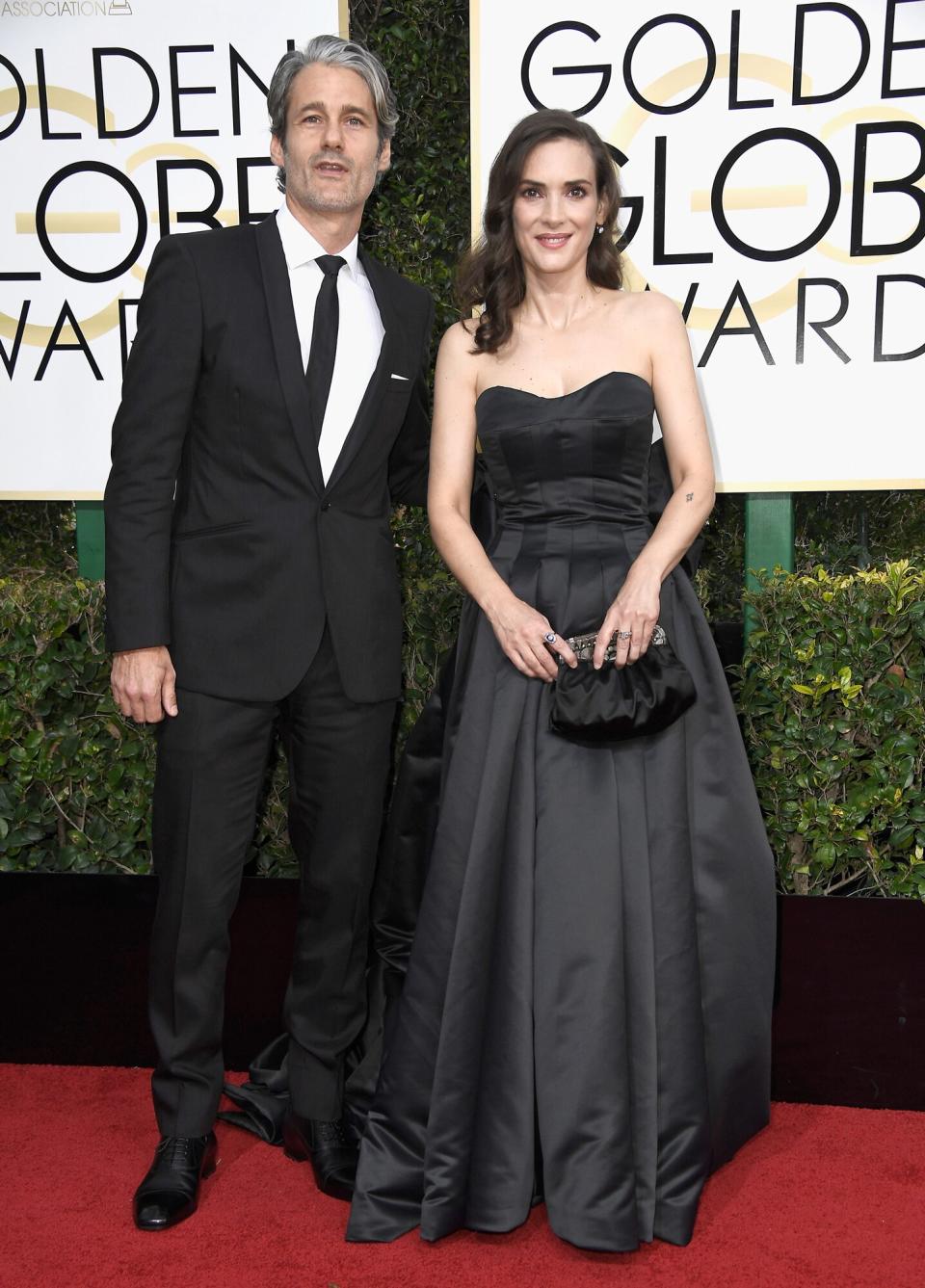 Winona Ryder and Scott Mackinlay Hahn attend the 74th Annual Golden Globe Awards at The Beverly Hilton Hotel on January 8, 2017 in Beverly Hills, California