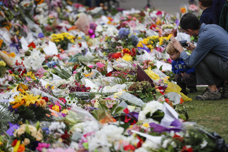 Mourners lay flowers on a wall at the Botanical Gardens in Christchurch, New Zealand last month. Source: AAP