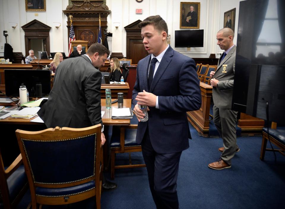 Kyle Rittenhouse, center, walks off the witness stand for a short recess after breaking down during his testimony at his trial at the Kenosha County Courthouse in Kenosha, Wis., on Wednesday, Nov. 10, 2021.