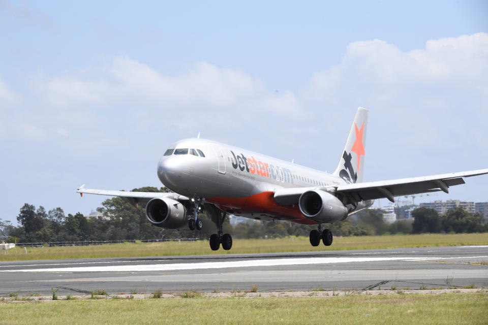 A Jetstar aircraft lands at Sydney Airport.