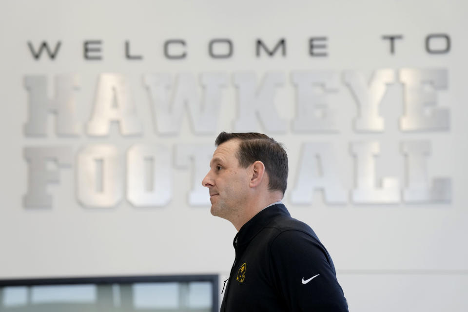 New Iowa offensive coordinator Tim Lester waits to speak at an NCAA college football news conference, Tuesday, Feb. 6, 2024, in Iowa City, Iowa. (AP Photo/Charlie Neibergall)