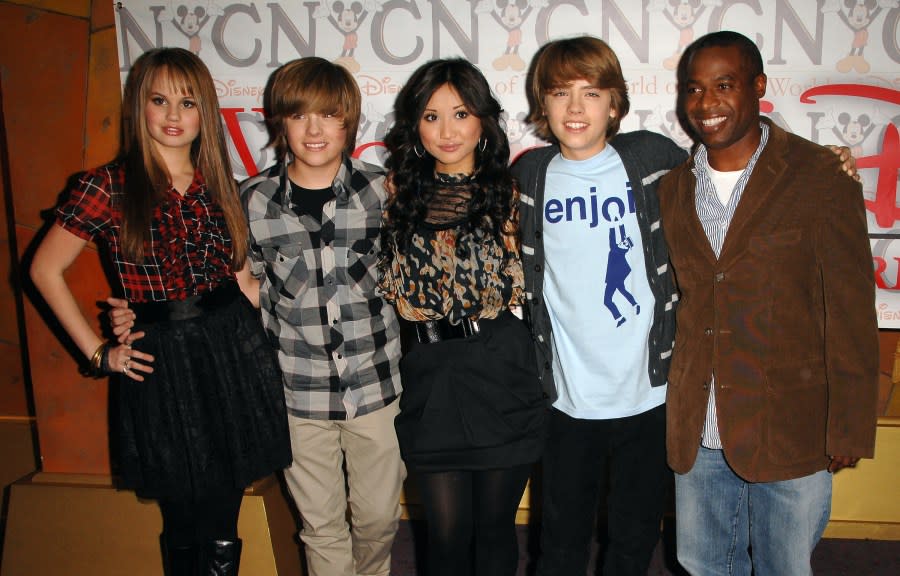 From left actors Debby Ryan, Dylan Sprouse, Brenda Song, Cole Sprouse and Phill Lewis make an appearance at the Disney store to promote their new show “The Suite Life on Deck”, in New York, on Friday, March. 6, 2009. (AP Photo/Peter Kramer)