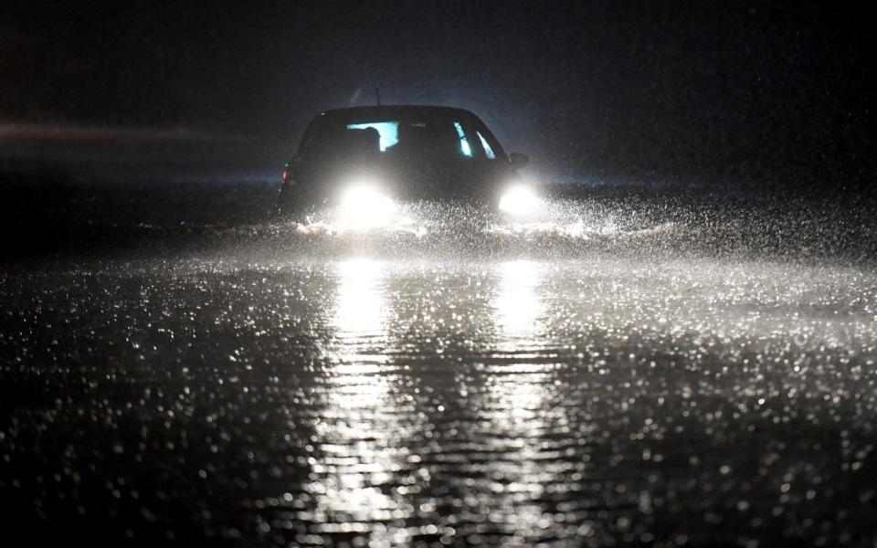 Cars negotiate a flooded road in Penarth, South Wales - Ben Evans/Huw Evans Agency /Huw Evans Picture Agency 