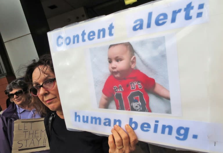 People protest outside an immigration office in Sydney on February 4, 2016, as Australian church leaders say they would offer sanctuary to asylum-seekers set to be deported to Nauru, to defy the government's harsh immigration policy