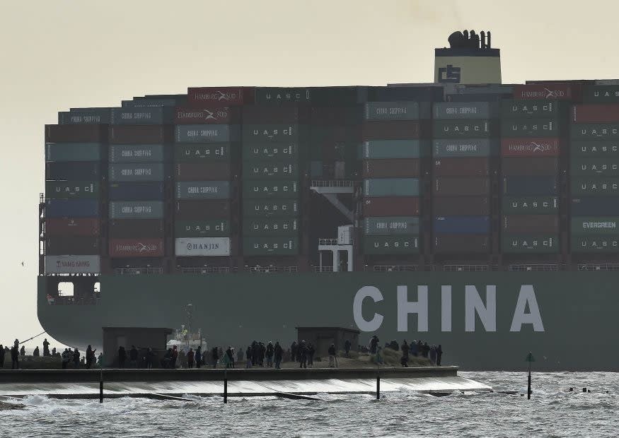 Onlookers watch from a harbour wall as the largest container ship in world, CSCL Globe, docks during its maiden voyage, at the port of Felixstowe in south east England (Reuters)