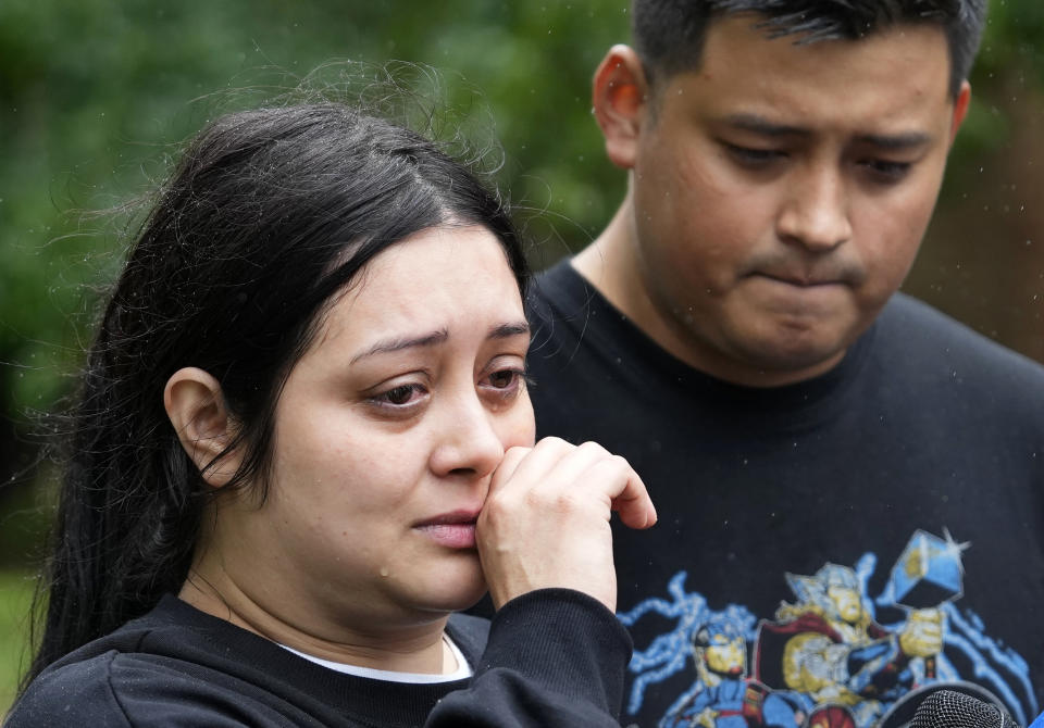 CORRECTION CORRECTS NAME Haley Loredo with her brother, Elmer Alvarado, wipes away tears outside her home in the 17400 block of Rustic Canyon Trail where her mother-in-law, Maria Loredo, 74, died after a tree fell on her second story bedroom during Hurricane Beryl, Monday, July 8, 2024, in Houston. (Melissa Phillip/Houston Chronicle via AP)