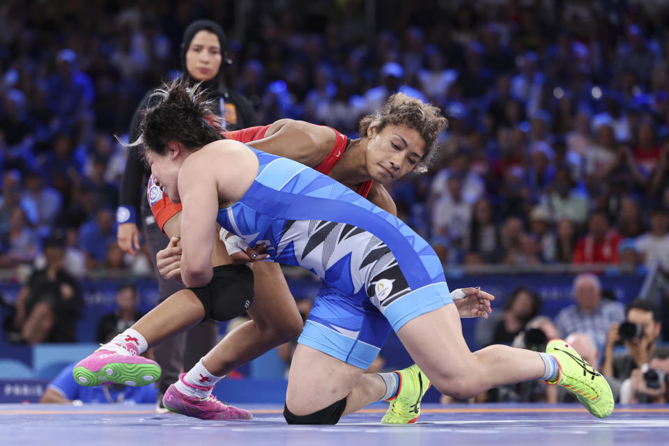 PARIS, FRANCE – AUGUST 11: Yuka Kagami of Japan fights against Kennedy Alexis Blades of the USA in the 76kg women's wrestling final 1-2 during the Olympic Games on August 11, 2024 in Paris, France. (Photo by Kadir Caliskan – United World Wrestling/Getty Images)