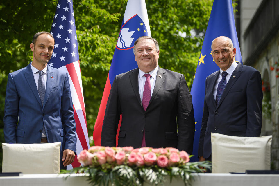 Slovenia's Foreign Minister Anze Logar, left, US Secretary of State Mike Pompeo, center, and Slovenia's Prime Minister Janez Jansa pose for the media after signing an agreement on fifth-generation internet technology in Bled, Slovenia, Thursday, Aug. 13, 2020. Pompeo is on a five-day visit to central Europe with a hefty agenda including China's role in 5G network construction. (Jure Makovec/Pool Photo via AP)