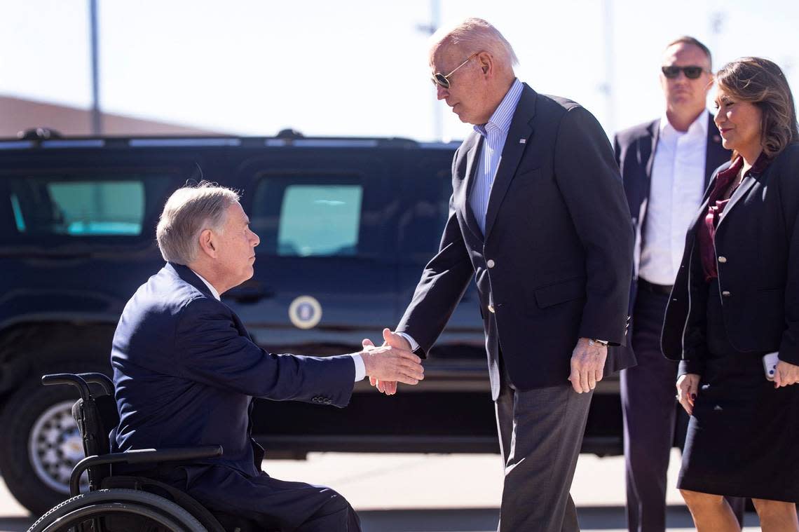 President Joe Biden exchanges handshakes with Texas Gov. Greg Abbott when the president arrived in El Paso on Jan. 8, 2023, to assess border enforcement operations and meet with community leaders.