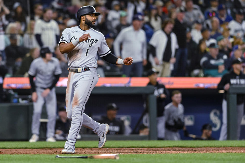 Chicago White Sox's Elvis Andrus looks back after scoring the go-ahead run against the Seattle Mariners during the 11th inning of a baseball game Saturday, June 17, 2023, in Seattle. (AP Photo/Caean Couto)