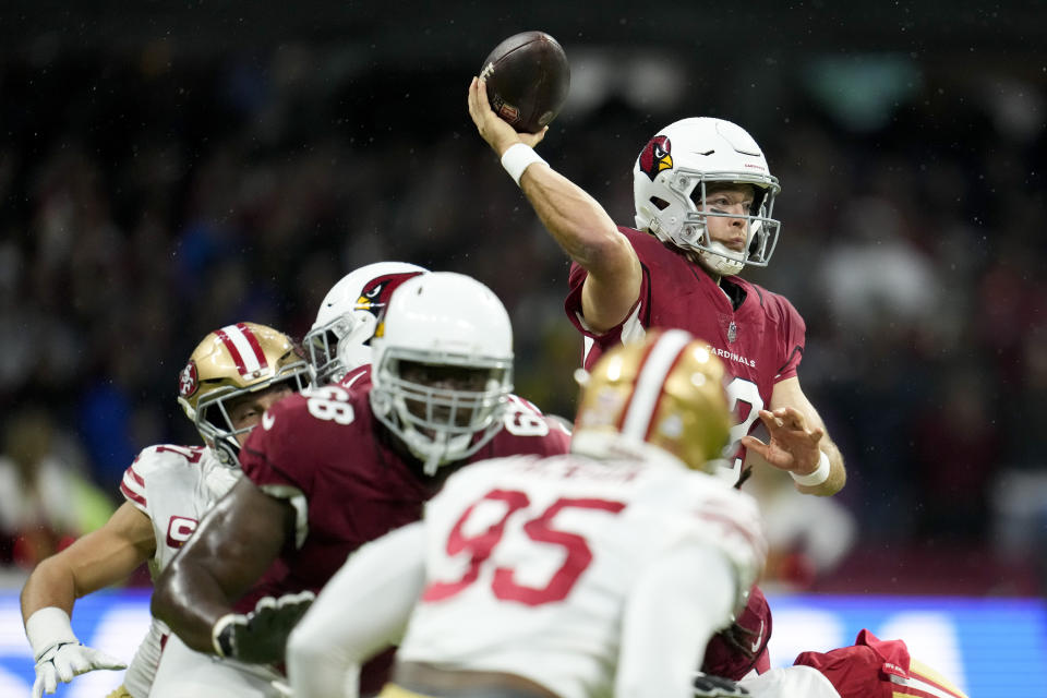 Arizona Cardinals quarterback Colt McCoy throws a pass during the first half of an NFL football game against the San Francisco 49ers, Monday, Nov. 21, 2022, in Mexico City. (AP Photo/Marcio Jose Sanchez)