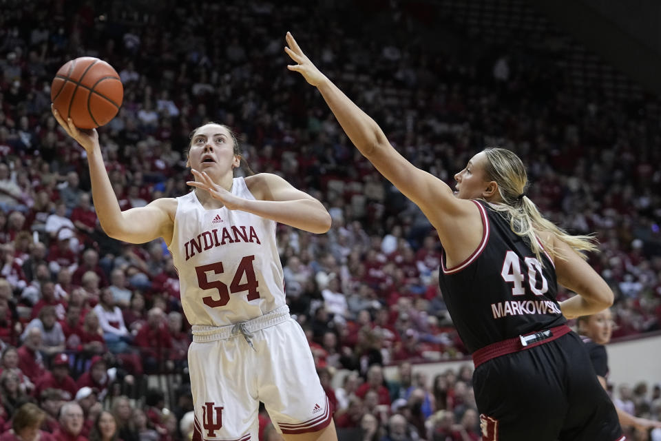 Indiana's Mackenzie Holmes (54) puts up a shot against Nebraska's Alexis Markowski (40) during the second half of an NCAA college basketball game, Sunday, Jan. 1, 2023, in Bloomington, Ind. (AP Photo/Darron Cummings)