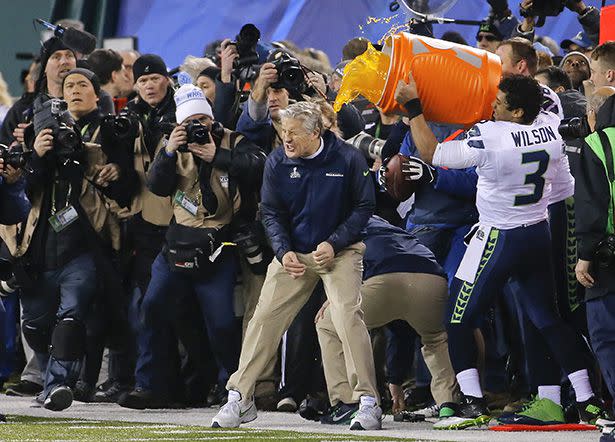 Seattle Seahawks quarterback Russell Wilson (3) dumps Gatorade on head coach Pete Carroll near the end of the NFL Super Bowl XLVIII football game against the Denver Broncos, Sunday, Feb. 2, 2014, in East Rutherford, N.J. Seattle won 43-8. (AP Photo/Matt York)