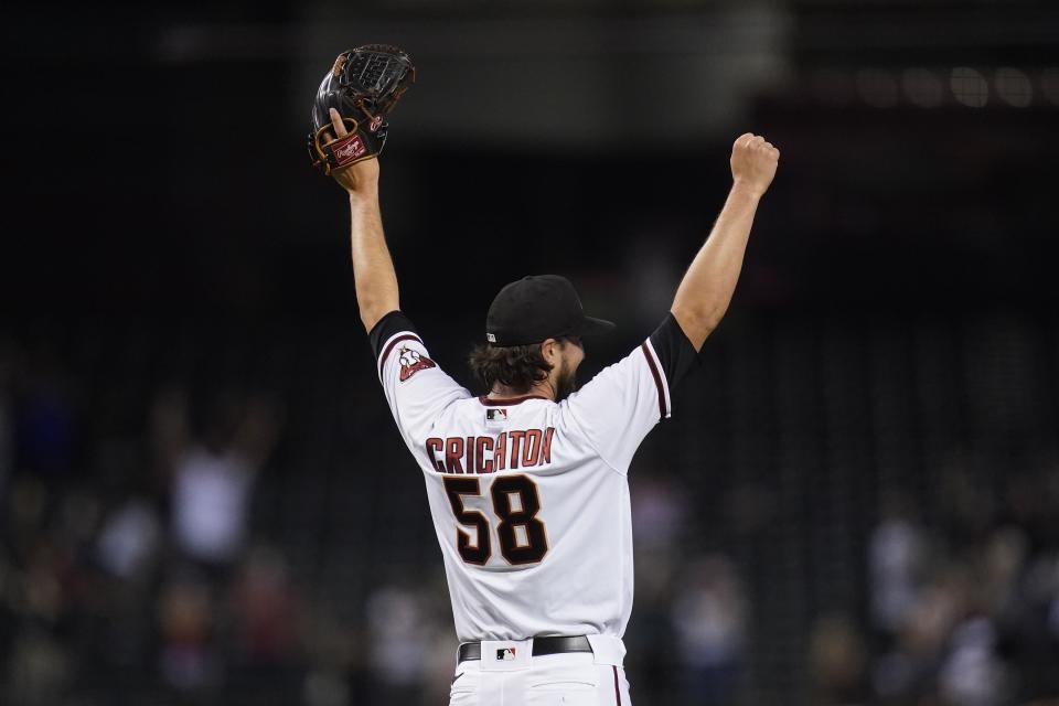 Arizona Diamondbacks relief pitcher Stefan Crichton celebrates the final out against the Miami Marlins in the ninth inning a baseball game Monday, May 10, 2021, in Phoenix. The Diamondbacks defeated the Marlins 5-2. (AP Photo/Ross D. Franklin)