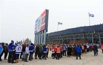 Spectators wait in a long line prior to entering Michigan Stadium for the 2014 Winter Classic hockey game between the Detroit Red Wings and the Toronto Maple Leafs at Michigan Stadium. Mandatory Credit: Andrew Weber-USA TODAY Sports