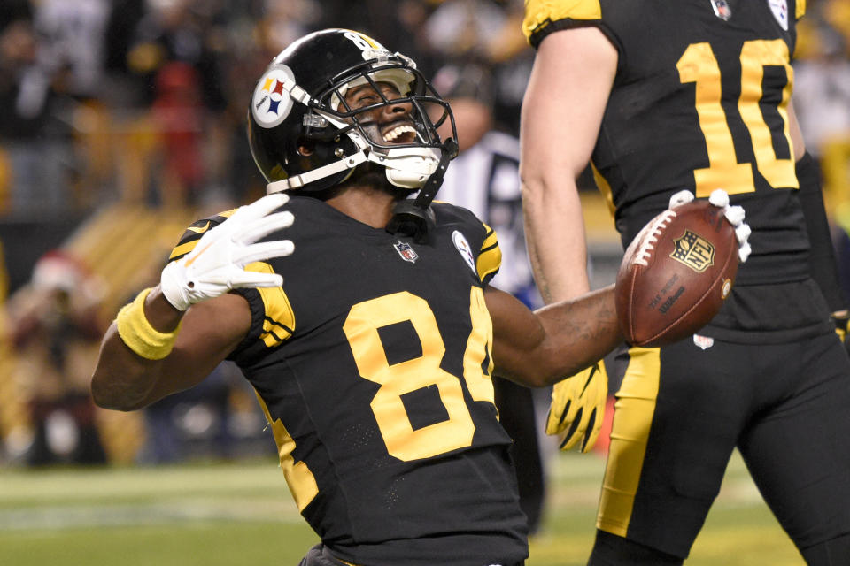 Pittsburgh Steelers wide receiver Antonio Brown (84) celebrates after catching a touchdown pass from quarterback Ben Roethlisberger during the first half of an NFL football game against the New England Patriots in Pittsburgh, Sunday, Dec. 16, 2018. (AP Photo/Don Wright)