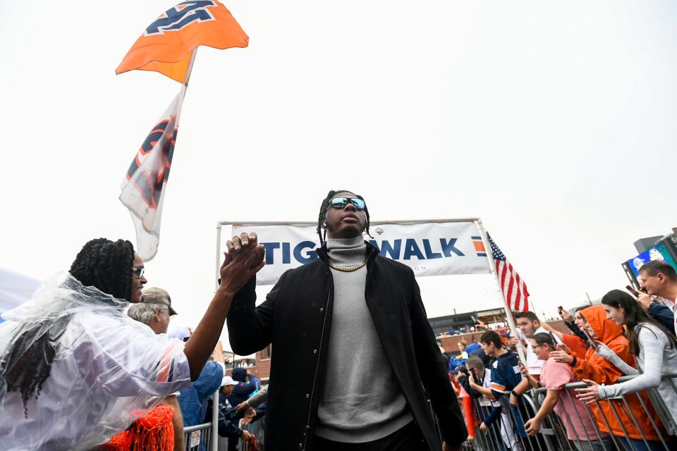 Auburn Tigers quarterback T.J. Finley (1) greets in the Tiger Walk before the Birmingham Bowl at Protective Stadium in Birmingham, Ala., on Tuesday December 28, 2021.