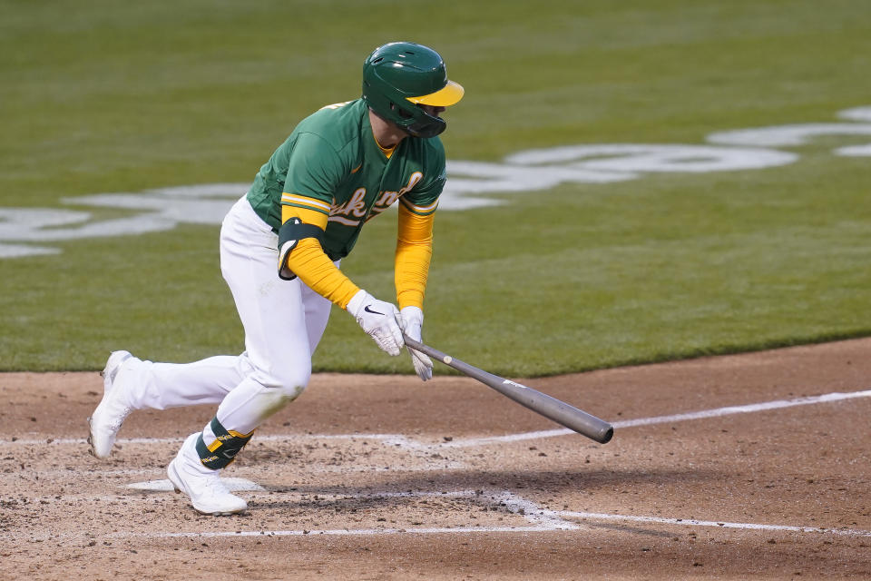 Oakland Athletics' Seth Brown hits a run-scoring single against the Minnesota Twins during the fourth inning of the second baseball game of a doubleheader in Oakland, Calif., Tuesday, April 20, 2021. (AP Photo/Jeff Chiu)