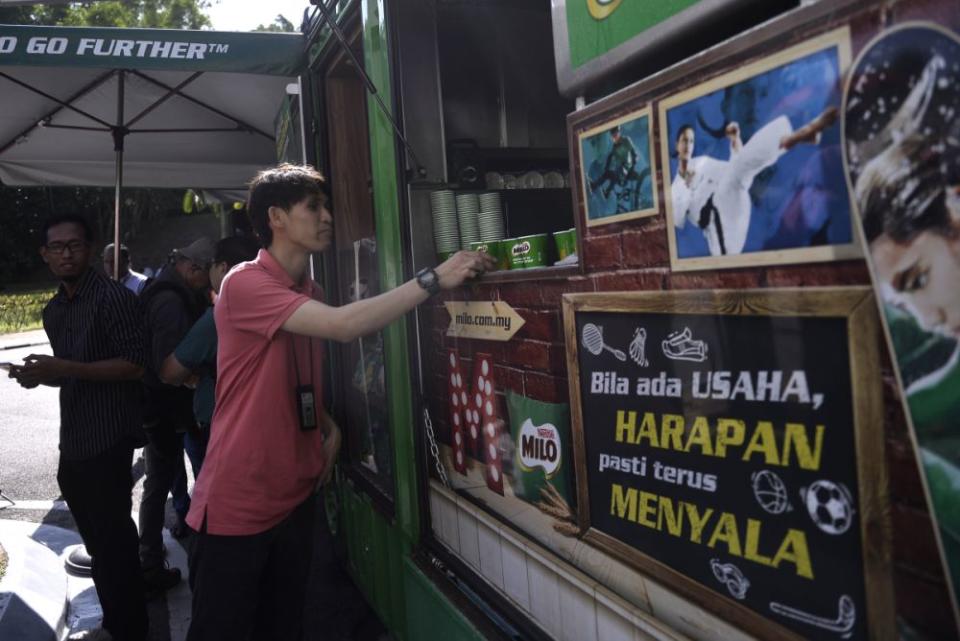 A Milo truck serves beverages to members of the media outside Istana Negara February 26, 2020. — Picture by Miera Zulyana