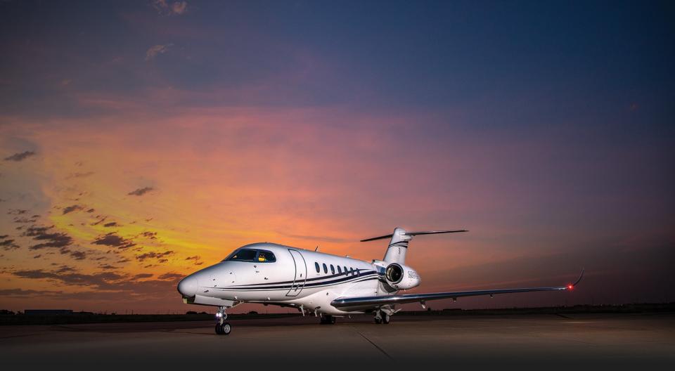 Textron Cessna Citation Jet with sunset in the background.