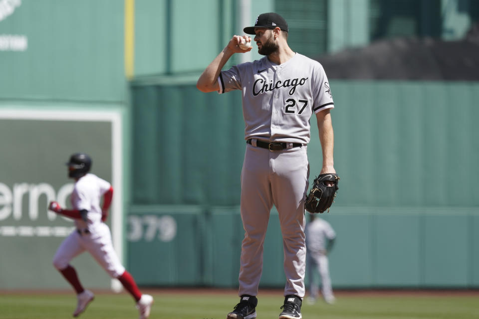 Chicago White Sox starting pitcher Lucas Giolito reacts after giving up a solo home run to Boston Red Sox's Enrique Hernandez, left, in the first inning of a baseball game at Fenway Park, Monday, April 19, 2021, in Boston. (AP Photo/Elise Amendola)