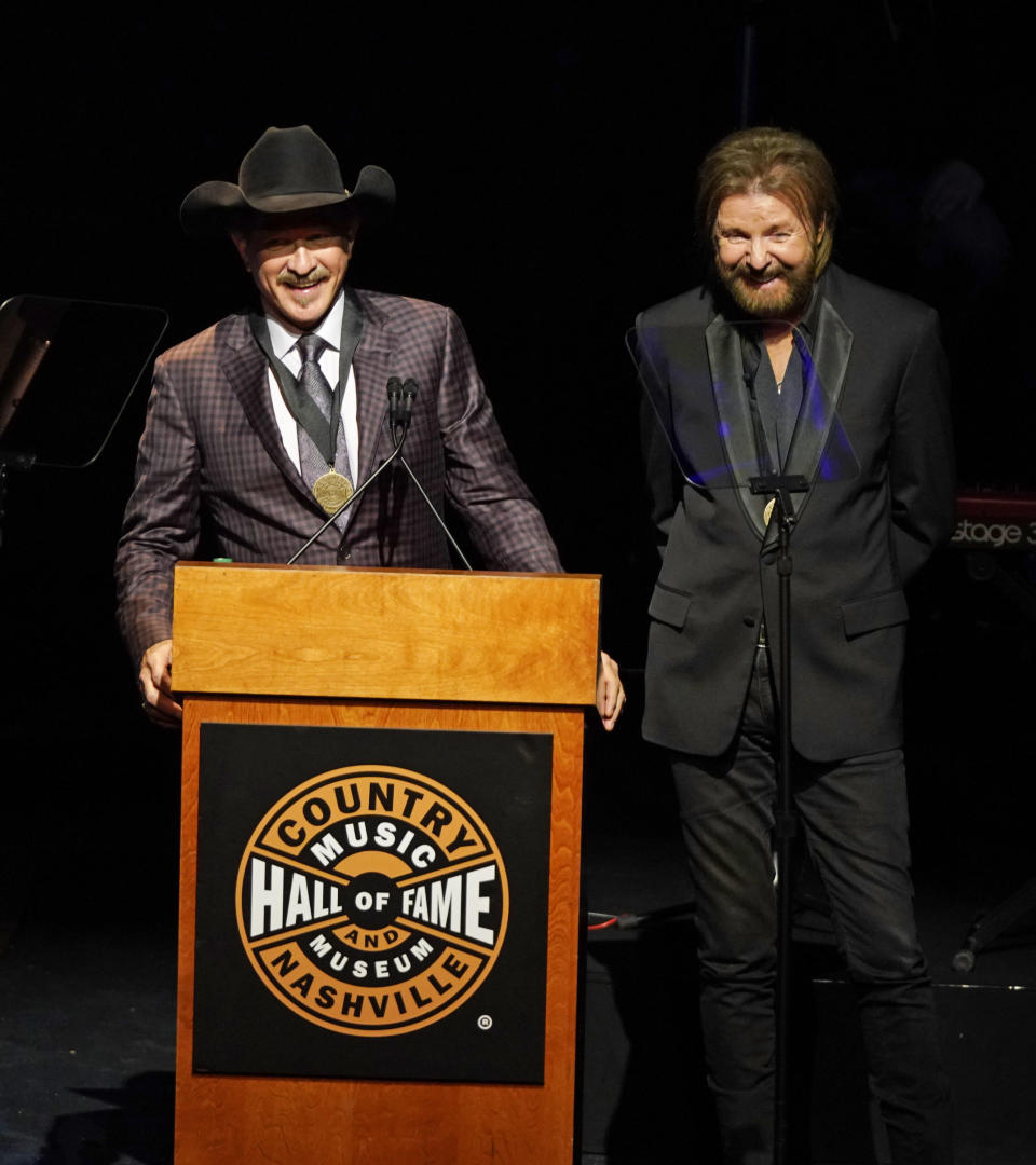 Kix Brooks, left, and Ronnie Dunn, right, speak after being inducted into the Country Music Hall of Fame at 2019 Medallion Ceremony at the Country Music Hall of Fame and Museum on Sunday, Oct. 20, 2019 in Nashville, Tenn. (Photo by Sanford Myers/Invision/AP)