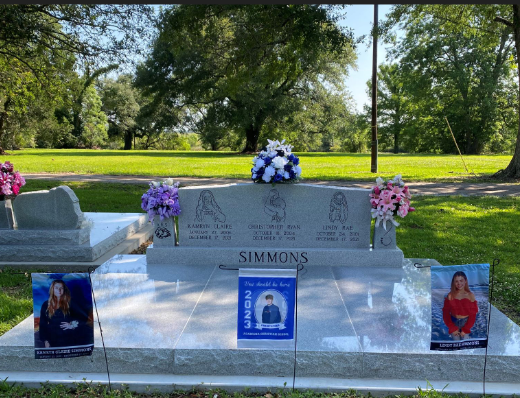 The joint gravestone of Lindy, Christopher and Kamryn Simmons is pictured.
