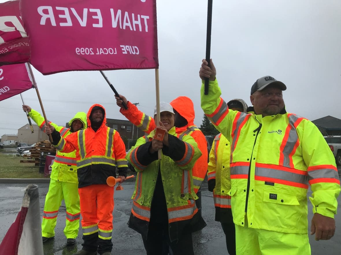 A group of striking city workers demonstrate outside the public works depot on Clyde Avenue in Mount Pearl, N.L. (Terry Roberts/CBC - image credit)