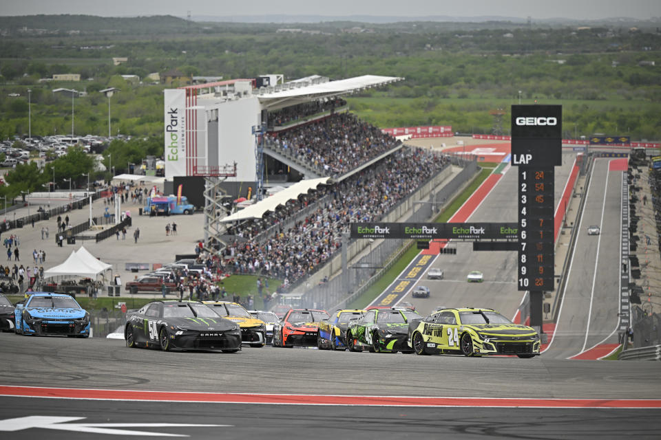 Drivers steers through Turn 1 to start a NASCAR Cup Series auto race on Sunday, March 24, 2024, at Circuit of the Americas in Austin, Texas. (AP Photo/Darren Abate)