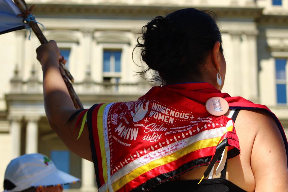 Red Crow Woman, Kelly Hawkins, of the Saginaw Chippewa Indian Tribe and Alaskan Native Tlingit, wears red cloth for Missing Murdered Indigenous Woman at the Longest Walk 5 on June 17, 2022, at the State Capitol.