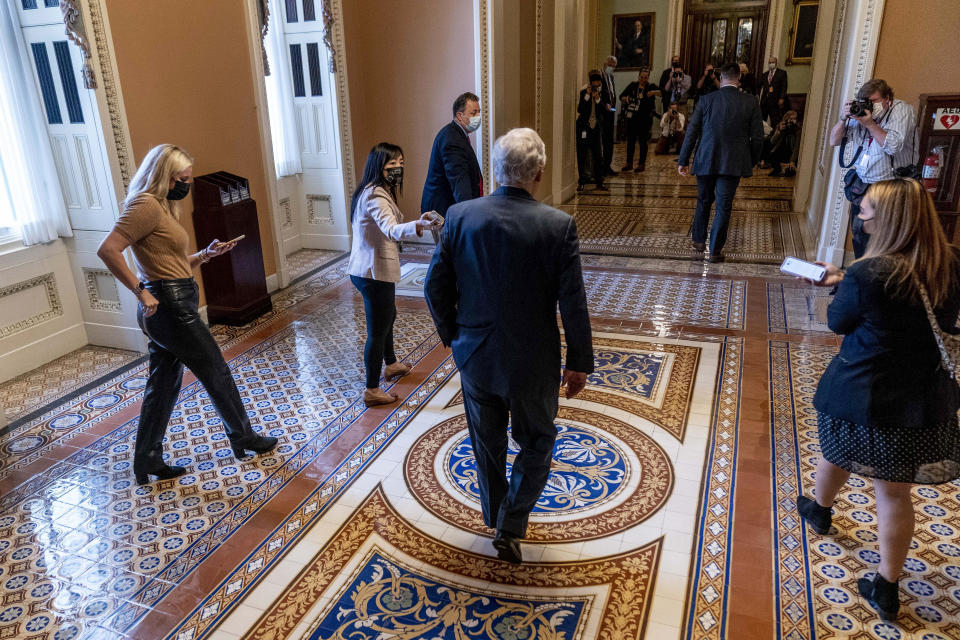 Senate Minority Leader Mitch McConnell of Ky., walks towards the Senate Chamber at the Capitol in Washington, Wednesday, Oct. 6, 2021, as a showdown looms with Democrats over raising the debt limit, at the Capitol in Washington, Wednesday, Oct. 6, 2021. (AP Photo/Andrew Harnik)