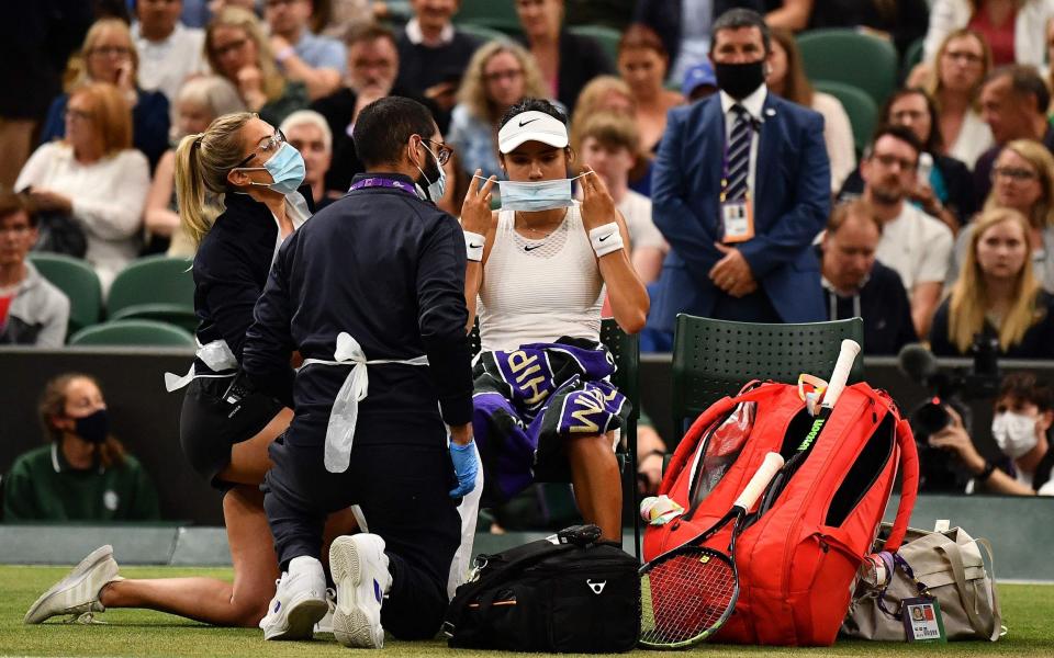 Emma Raducanu receives medical aid during the match against Australia's Ajla Tomljanovic - Getty