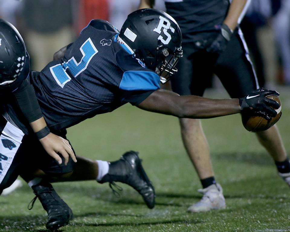 Plymouth South's Casious Johnson extends the ball to get the first down on a carry during first quarter action of their game against Foxborough at Plymouth South High on Friday, Sept. 23, 2022. Plymouth South would go on to win 21-14.